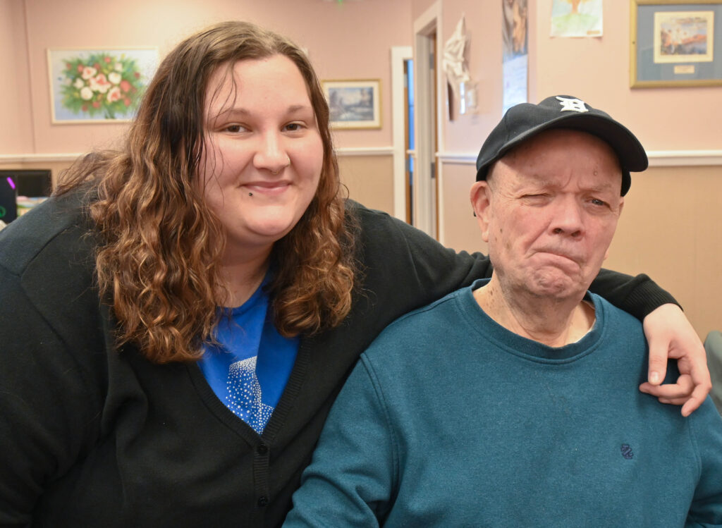 Service Instructor Lea Church supports John, a participant at Auburn Day Hab.