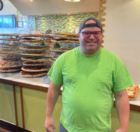 UES participant Robert works at a local Auburn pizzeria and receives employment support through Unity House.