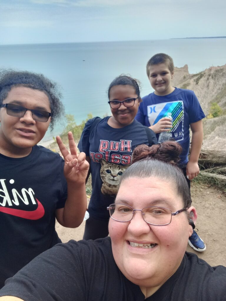 Amy Jefferson takes a selfie on a hike with her children at Chimney Bluffs State Park.